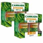 Pack promocional de Cannabis Strong 1000 mg da marca Novity. O produto contém dois frascos de cápsulas de óleo de sementes de cannabis, totalizando 60 cápsulas, com uma oferta adicional de 30+30 cápsulas. A embalagem apresenta tons de verde e laranja, com um fundo ilustrado por folhas de cannabis, destacando a concentração de 1000 mg por cápsula. Este suplemento é ideal para quem procura os benefícios do óleo de cânhamo, sendo indicado para o suporte do sistema imunitário e cardiovascular.